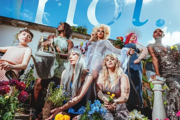 Magazine cover featuring a group of women in a garden with mulch and plants around them 
