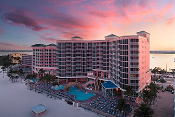 Pink Shell Resort pink buildings with pink sunrise in background
